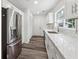 Updated kitchen featuring new stainless steel appliances and white marble countertops at 1978 Ethel Ln, Decatur, GA 30032