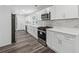Modern kitchen with stainless steel appliances, marble countertops, and subway tile backsplash at 1978 Ethel Ln, Decatur, GA 30032