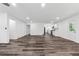Spacious room features luxury vinyl flooring, neutral paint, and access to kitchen at 1978 Ethel Ln, Decatur, GA 30032