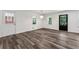 Cozy living space featuring luxury vinyl floors, lots of light and entry to backyard at 1978 Ethel Ln, Decatur, GA 30032