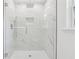 Modern shower featuring marble tiles and sleek glass door at 1978 Ethel Ln, Decatur, GA 30032
