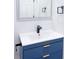 Chic bathroom with modern vanity featuring stylish blue cabinetry and gold hardware at 2526 Center Nw St, Atlanta, GA 30318