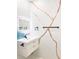Stylish bathroom vanity with modern sink, lighted mirror, and unique branch design on the wall at 2526 Center Nw St, Atlanta, GA 30318
