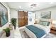 Stylishly staged bedroom featuring modern decor, barn door closet, and calming color palette at 2526 Center Nw St, Atlanta, GA 30318
