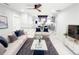 Staged living room featuring a white sofa, marble coffee table and white marble-look floors at 2526 Center Nw St, Atlanta, GA 30318