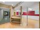 Spacious basement features wood floors, a bar counter, and a checkered tile floor at 3105 Sumac Dr, Atlanta, GA 30360