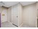 Unfinished section of the basement with concrete floors and a utility door at 3105 Sumac Dr, Atlanta, GA 30360