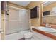 Bathroom featuring a vanity with cabinet, a shower and bathtub combo with glass doors at 3105 Sumac Dr, Atlanta, GA 30360