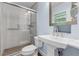 Clean bathroom with a stand alone sink, toilet and glass enclosed walk in shower at 3105 Sumac Dr, Atlanta, GA 30360
