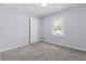 Light gray bedroom with new carpets, one window and white trim at 3105 Sumac Dr, Atlanta, GA 30360