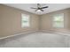 Bright bedroom with natural light from two windows and neutral-colored carpet at 3105 Sumac Dr, Atlanta, GA 30360