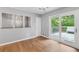 Bright dining area with sliding doors leading to an outdoor deck and modern light fixture at 3105 Sumac Dr, Atlanta, GA 30360