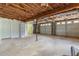 Large garage with three garage doors, built-in storage, and unfinished walls at 3105 Sumac Dr, Atlanta, GA 30360