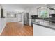Modern kitchen featuring stainless steel appliances, white cabinets, and hardwood floors at 3105 Sumac Dr, Atlanta, GA 30360