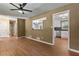 Inviting living room featuring wood floors, and views into the kitchen and hallway at 3105 Sumac Dr, Atlanta, GA 30360