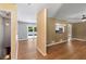 Open living space featuring hardwood floors, large windows, and access to a deck and kitchen at 3105 Sumac Dr, Atlanta, GA 30360