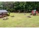 Community playground with swings, slides, and a fire pit at 3105 Sumac Dr, Atlanta, GA 30360