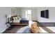 Cozy bedroom with modern decor, balcony access, and mounted television at 1941 Brian Way # 1941, Decatur, GA 30033
