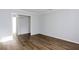 Neutral interior design with a view to a hallway, doorway, and sleek wood floors at 1941 Brian Way # 1941, Decatur, GA 30033