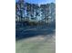 Outdoor tennis court, surrounded by trees, providing recreational amenities for residents at 1941 Brian Way # 1941, Decatur, GA 30033