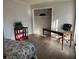 Bedroom featuring hardwood floors, neutral paint, and a desk at 4876 Velva Nw Way, Lilburn, GA 30047