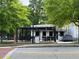 Charming wine bar with outdoor seating under a pergola, inviting customers with a relaxing atmosphere and parking at 4876 Velva Nw Way, Lilburn, GA 30047