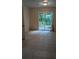 A versatile room bathed in light from sliding glass doors, ready to be transformed into your ideal space at 1009 Autumn Crest Ct, Stone Mountain, GA 30083