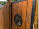 Close-up of a stained wood fence and decorative gate at 1041 Waverly Drive Dr, Lawrenceville, GA 30046