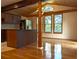 Kitchen area with stainless steel refrigerator, kitchen island and natural light at 1041 Waverly Drive Dr, Lawrenceville, GA 30046