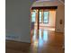 Living room with hardwood floors, arched doorway, and views into dining room at 1041 Waverly Drive Dr, Lawrenceville, GA 30046