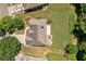 Aerial shot of the home showcasing the roof, deck, driveway, and large, well-maintained yard at 1170 Shellnut Trl, Hoschton, GA 30548