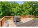 Wooden back deck with wooded views at 1170 Shellnut Trl, Hoschton, GA 30548