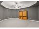 Large finished basement with gray walls, a ceiling fan, and carpet floors at 1170 Shellnut Trl, Hoschton, GA 30548