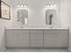 Bright bathroom with a double vanity, two mirrors, and gray cabinets provides ample storage at 1170 Shellnut Trl, Hoschton, GA 30548