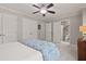 Bedroom featuring plush carpeting and a ceiling fan, creating a peaceful and relaxing retreat at 1170 Shellnut Trl, Hoschton, GA 30548