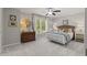 Bedroom with neutral paint, natural light, and carpeted flooring creating a serene and inviting atmosphere at 1170 Shellnut Trl, Hoschton, GA 30548