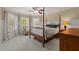 Spacious bedroom with carpet and natural light, creating a welcoming and comfortable atmosphere at 1170 Shellnut Trl, Hoschton, GA 30548