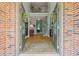 Bright foyer with hardwood floors and a staircase leading to an open second-story landing at 1170 Shellnut Trl, Hoschton, GA 30548