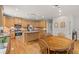 Open floor plan showcasing a kitchen with a center island and stainless steel appliances at 1170 Shellnut Trl, Hoschton, GA 30548