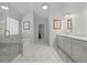 Well-lit, spacious main bathroom with a large marble shower and dual vanities at 1170 Shellnut Trl, Hoschton, GA 30548