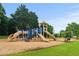 Community playground with slides, climbing structures, and a swing set for of all ages at 1170 Shellnut Trl, Hoschton, GA 30548