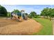 Community playground with slides, climbing structures, and a swing set for of all ages at 1170 Shellnut Trl, Hoschton, GA 30548