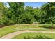 Neighborhood playground with swings, slides, and a grassy area for to enjoy outdoor activities at 1170 Shellnut Trl, Hoschton, GA 30548