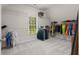 Spacious walk-in closet with a window provides ample storage and natural light at 1170 Shellnut Trl, Hoschton, GA 30548