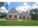 Charming brick home featuring a manicured lawn and classic architectural details at 7791 Capps Ridge Ln, Douglasville, GA 30135