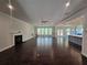 Spacious living room with fireplace, hardwood floors, and open layout at 7791 Capps Ridge Ln, Douglasville, GA 30135