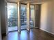 Room featuring shuttered glass doors opening to a private balcony at 1130 Piedmont Ne Ave # 404, Atlanta, GA 30309
