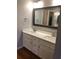 Bright bathroom featuring a double sink vanity with white cabinetry and stylish countertops at 1130 Piedmont Ne Ave # 404, Atlanta, GA 30309