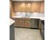 Bright kitchen with stainless steel appliances, tile flooring, and elegant white countertops at 1130 Piedmont Ne Ave # 404, Atlanta, GA 30309