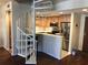 View of living area with spiral staircase, updated kitchen, and modern appliances at 1130 Piedmont Ne Ave # 404, Atlanta, GA 30309